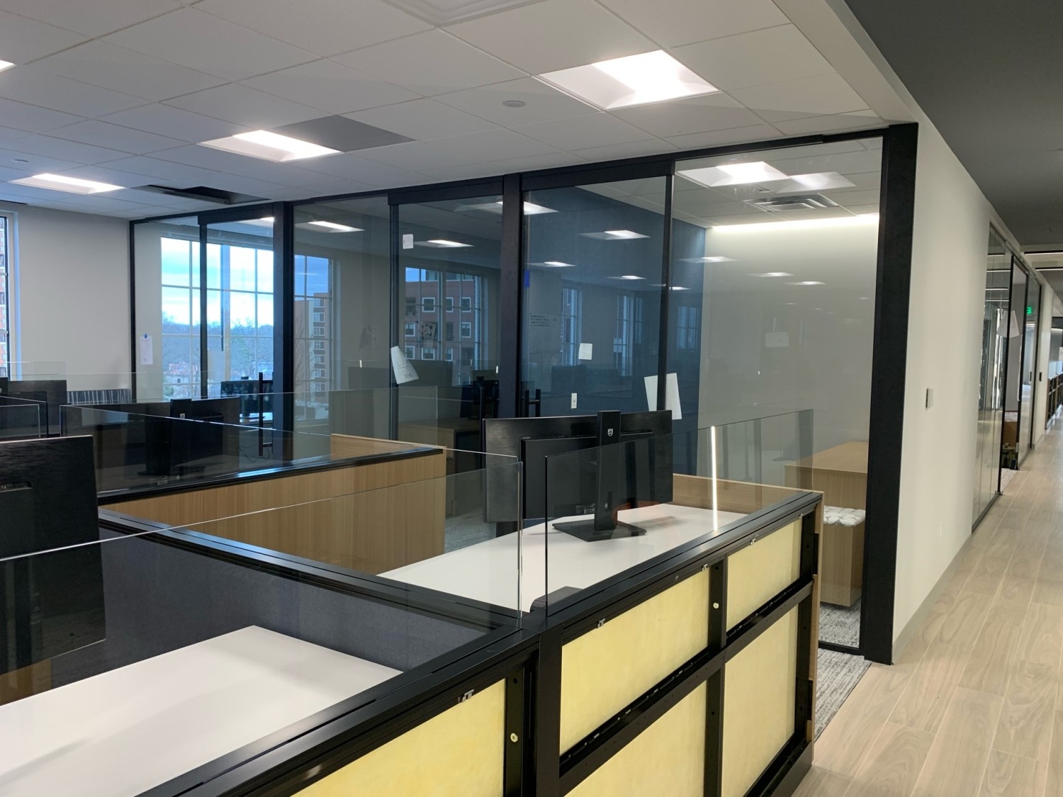 Commercial glass conference room installation with black-framed architectural wall system