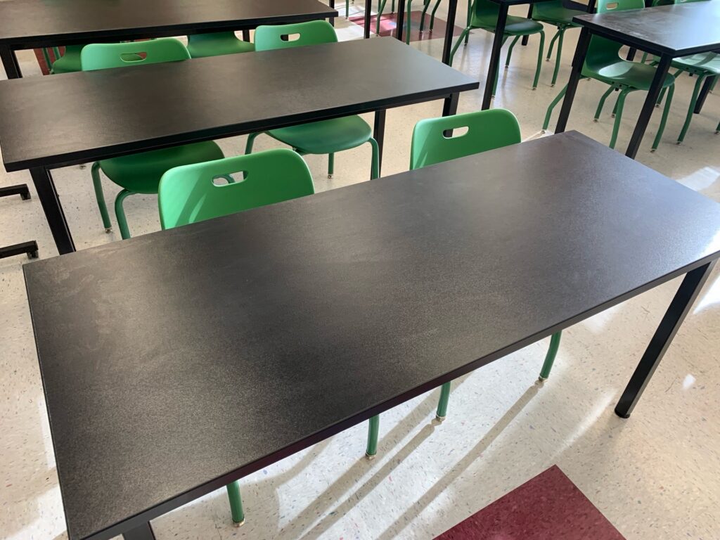black square table with green chairs