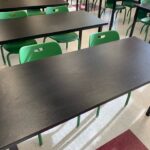 black square table with green chairs